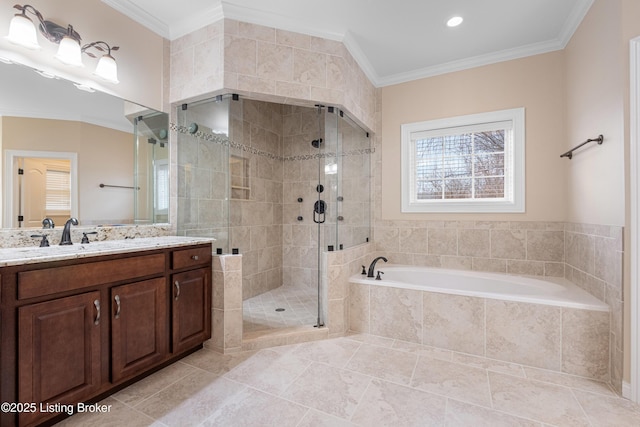 bathroom with plus walk in shower, crown molding, and vanity