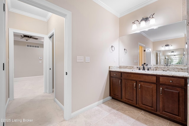 bathroom featuring vanity, crown molding, and ceiling fan