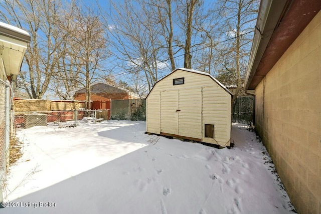 exterior space featuring an outbuilding, a fenced backyard, and a shed