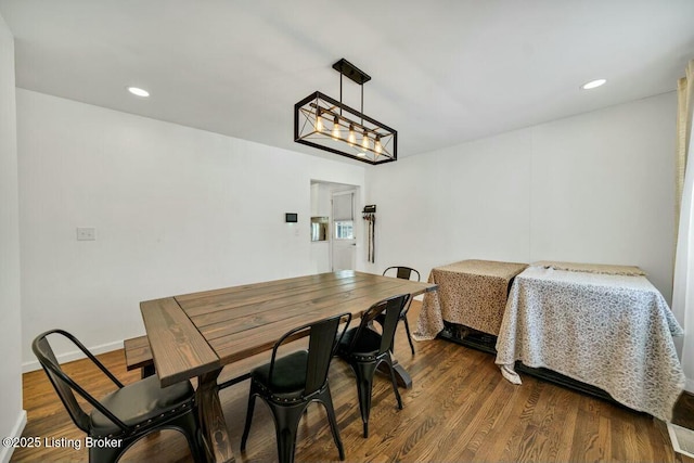 dining space featuring baseboards, dark wood-style flooring, and recessed lighting