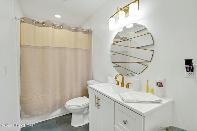 full bath with toilet, shower / bath combo with shower curtain, and vanity