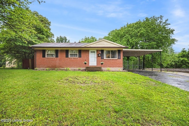 9828 Titan Dr, Louisville, KY 40229 - ranch-style house with asphalt driveway, brick siding, a carport, and entry steps