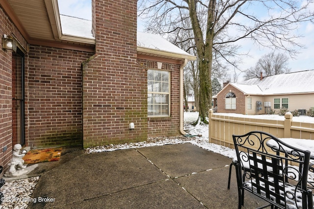 view of snow covered patio