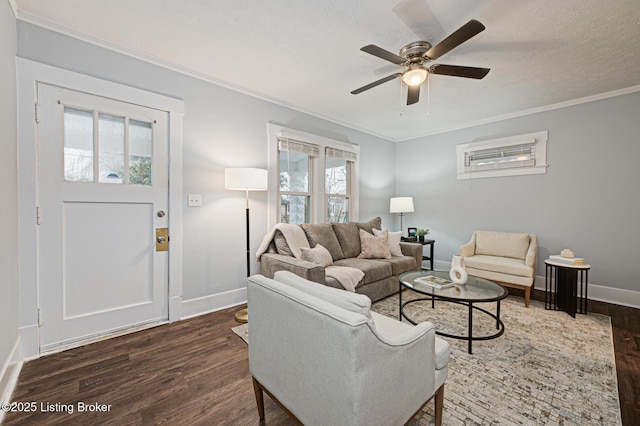 living room featuring crown molding, dark hardwood / wood-style floors, and a healthy amount of sunlight