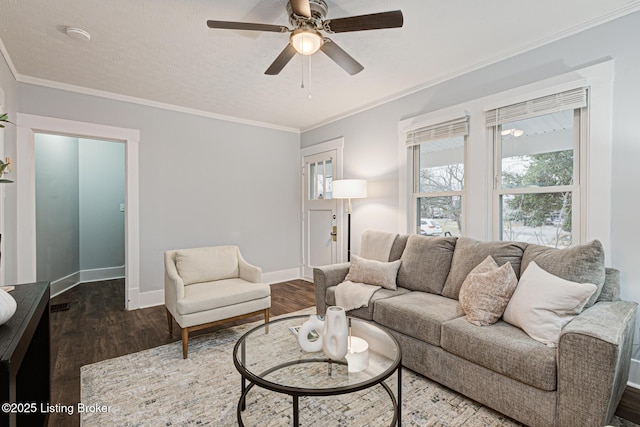 living room featuring ceiling fan, crown molding, dark hardwood / wood-style floors, and a textured ceiling