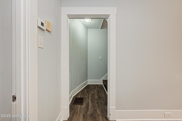 corridor with dark wood-type flooring