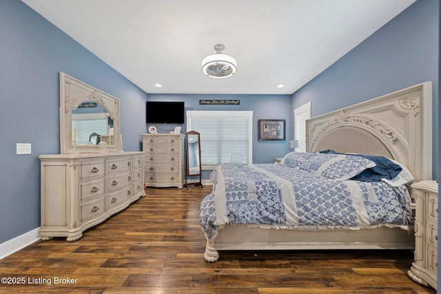 bedroom with dark wood-style floors, multiple windows, baseboards, and recessed lighting