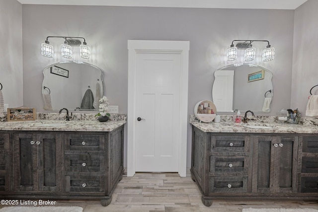 bathroom featuring vanity and wood finished floors