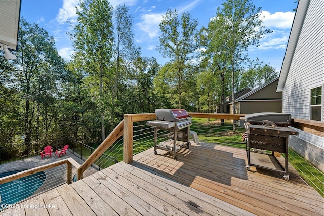 wooden deck featuring area for grilling