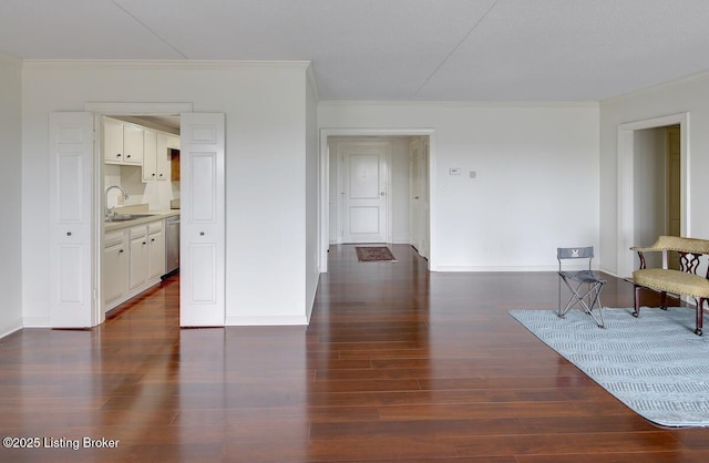 sitting room featuring sink, crown molding, and dark hardwood / wood-style floors