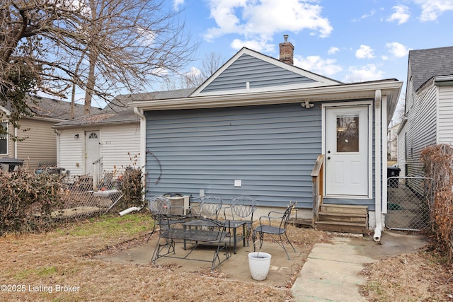 back of house with a patio