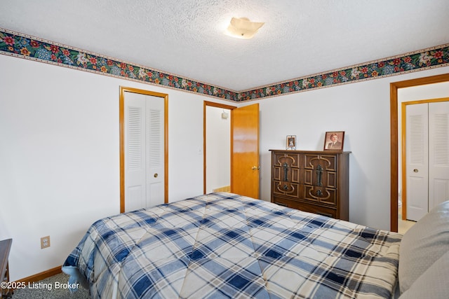 bedroom with carpet floors, a closet, and a textured ceiling