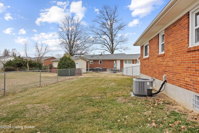 view of yard featuring central air condition unit