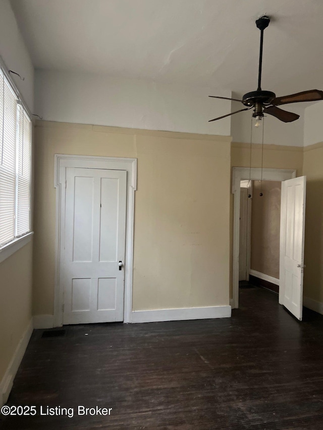 spare room featuring dark hardwood / wood-style flooring