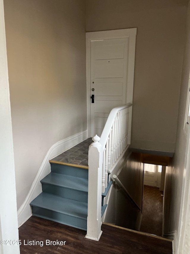 stairs with wood-type flooring