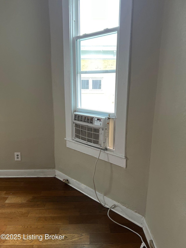 spare room with dark wood-type flooring and cooling unit