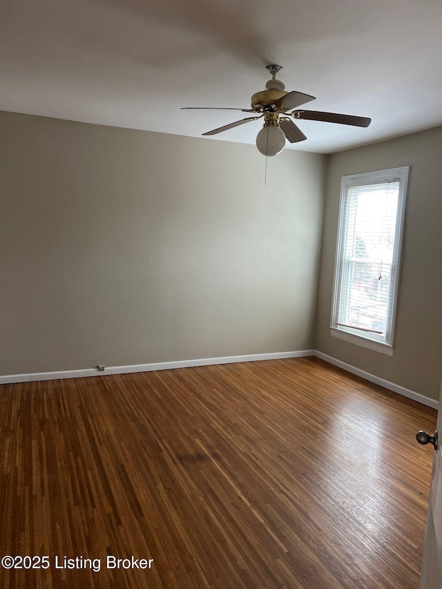 spare room featuring hardwood / wood-style flooring and ceiling fan