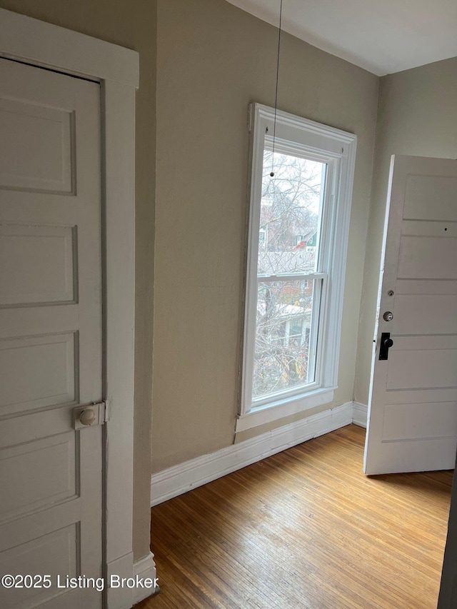 unfurnished dining area featuring hardwood / wood-style flooring