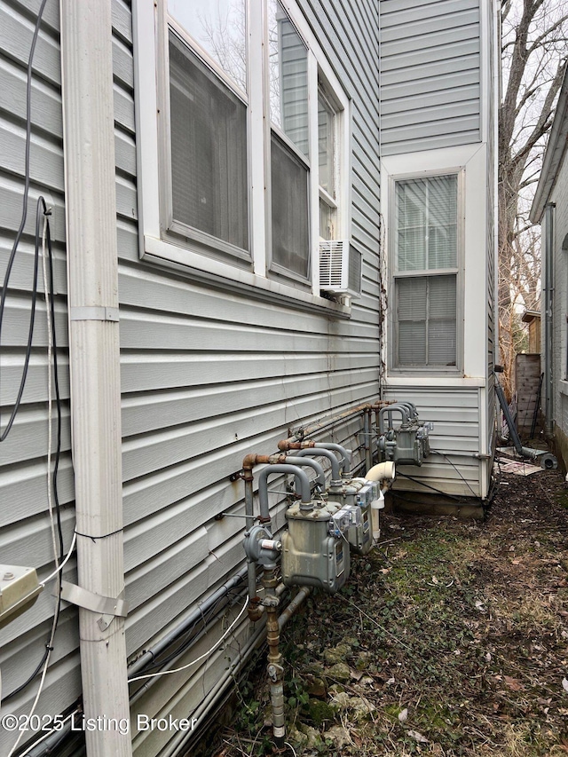 view of side of home featuring cooling unit