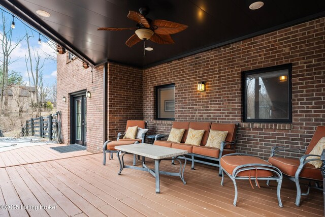 deck featuring an outdoor hangout area and a ceiling fan