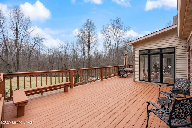 wooden deck with outdoor dining space