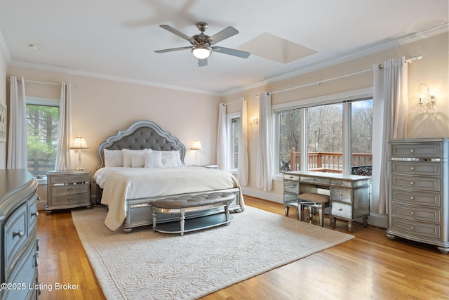 bedroom featuring light wood-style floors, ceiling fan, and crown molding