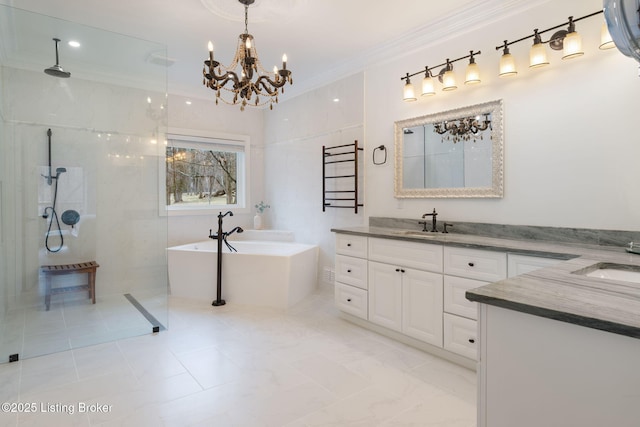 bathroom featuring a soaking tub, ornamental molding, an inviting chandelier, walk in shower, and vanity