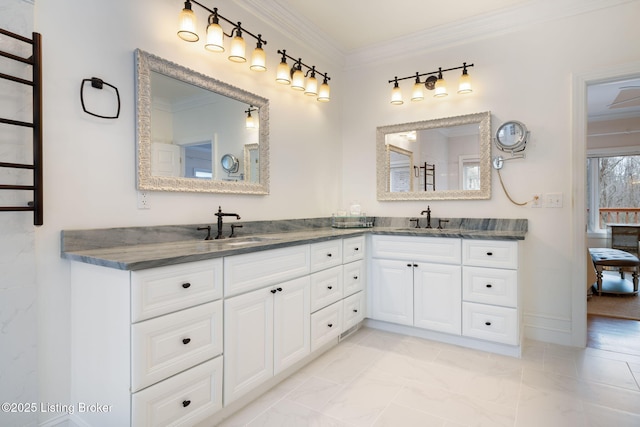 full bathroom with double vanity, a sink, and crown molding