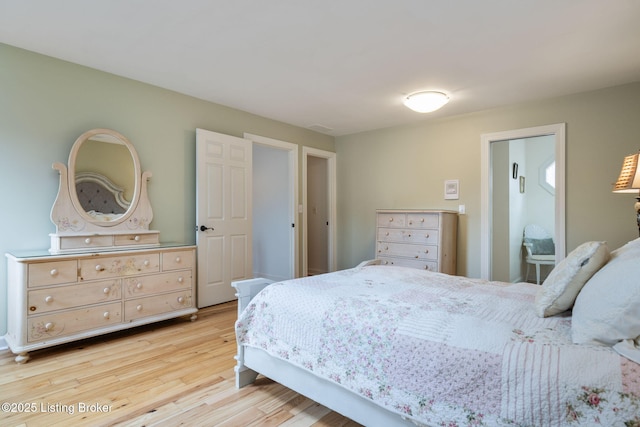 bedroom featuring light wood-style floors