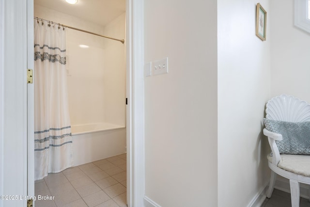 bathroom with shower / bath combination with curtain and tile patterned floors