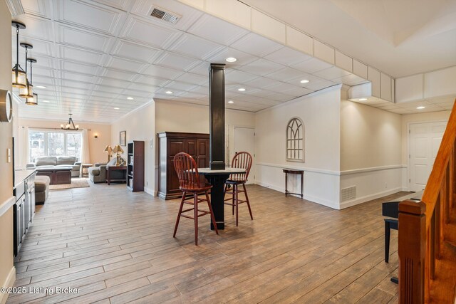 dining area with recessed lighting, visible vents, baseboards, and wood finished floors