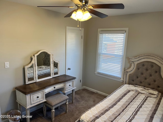 bedroom featuring dark carpet, a ceiling fan, and baseboards