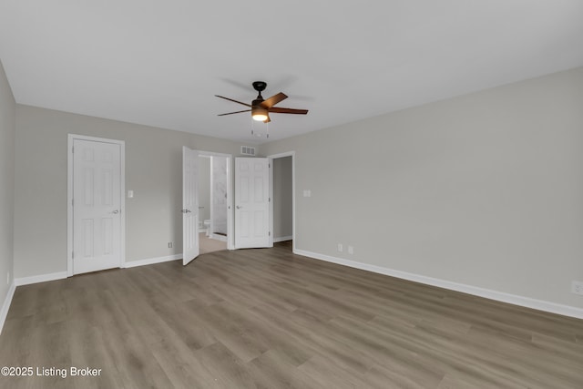 unfurnished bedroom with ceiling fan and light hardwood / wood-style floors