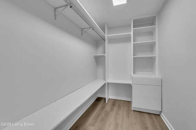 walk in closet featuring light hardwood / wood-style floors