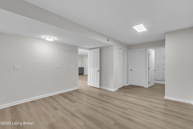 spare room with light hardwood / wood-style flooring