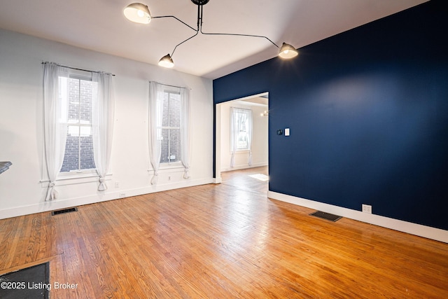 spare room featuring hardwood / wood-style floors