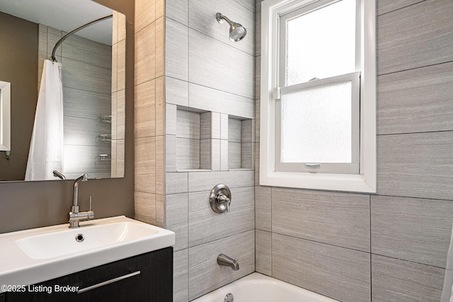 bathroom with vanity, a wealth of natural light, and shower / bath combo with shower curtain