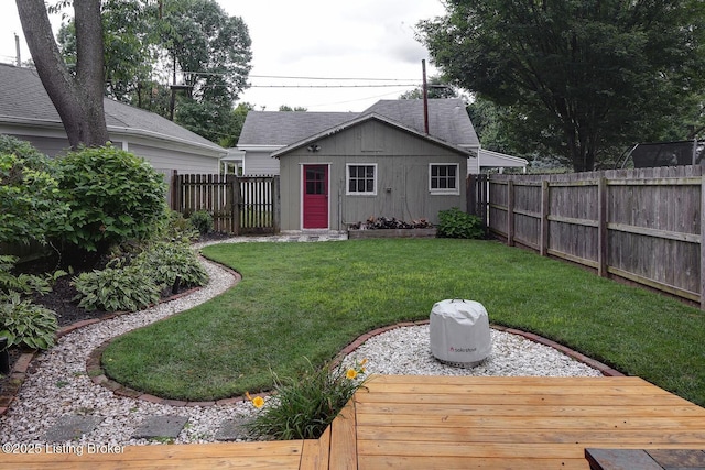 view of yard featuring an outbuilding and a deck