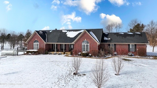 view of front of house with brick siding