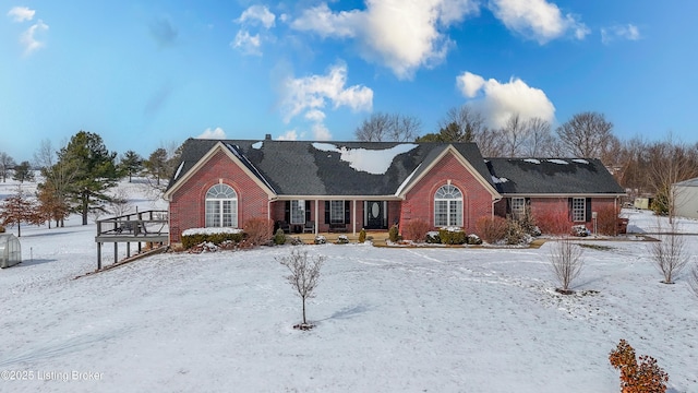 view of front of home featuring brick siding