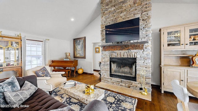 living room with high vaulted ceiling, baseboards, dark wood finished floors, and a stone fireplace