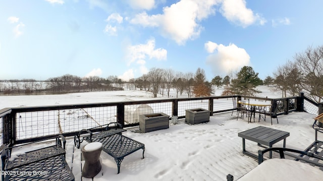 view of snow covered deck