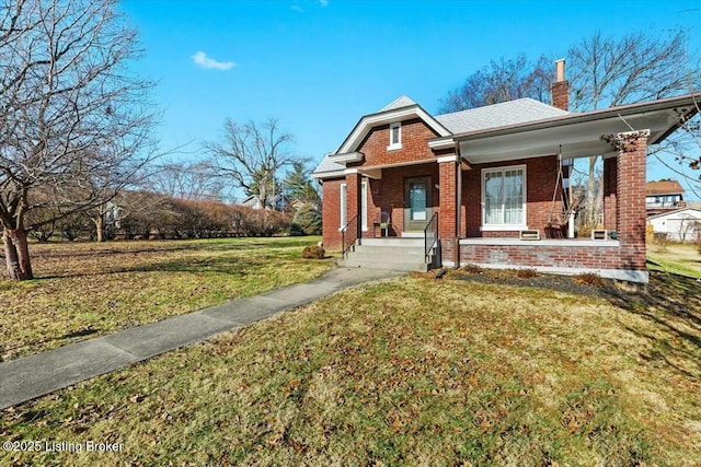 view of front of home featuring a front lawn and covered porch