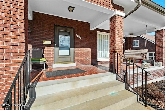 property entrance featuring covered porch