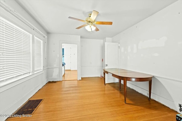 interior space with light hardwood / wood-style flooring and ceiling fan