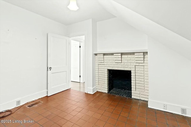 unfurnished living room with a fireplace and vaulted ceiling