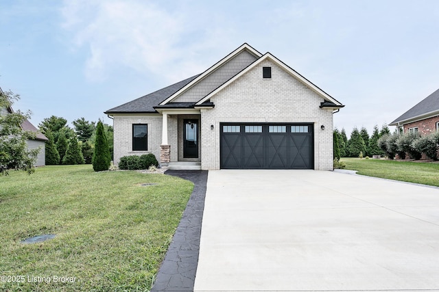 view of front of property featuring a garage and a front lawn