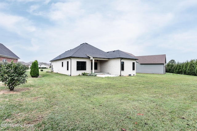 back of house featuring a yard and a patio area