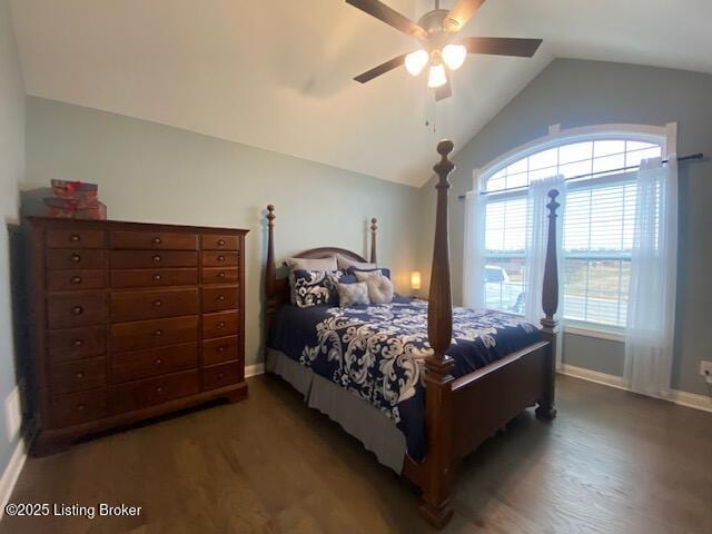 bedroom with dark wood-type flooring, vaulted ceiling, and ceiling fan