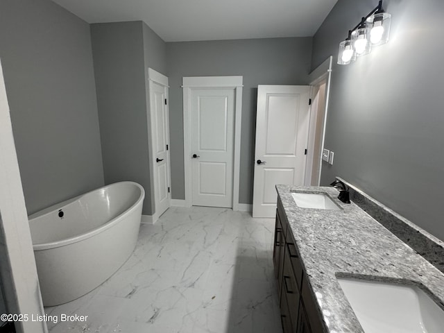 bathroom featuring vanity and a washtub